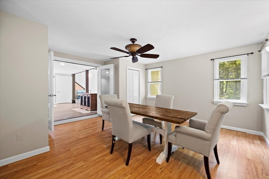 115 Douglas Road Webster, MA 01570 - Photo 16 of 42 a dining room with furniture a chandelier and wooden floor