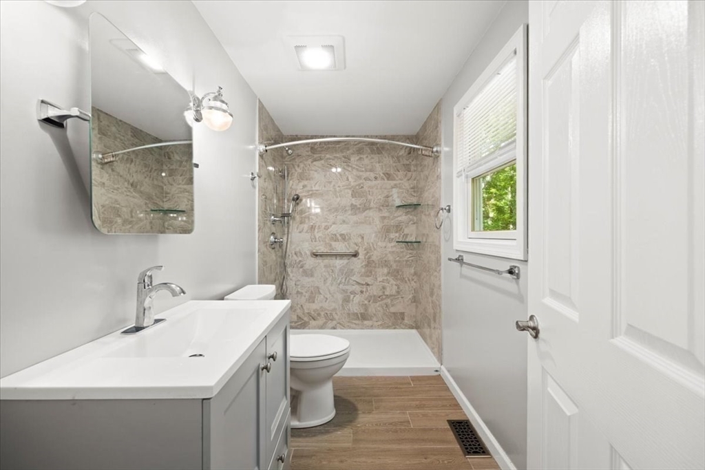 115 Douglas Road Webster, MA 01570 - Photo 19 of 42 a bathroom with a sink a toilet and shower