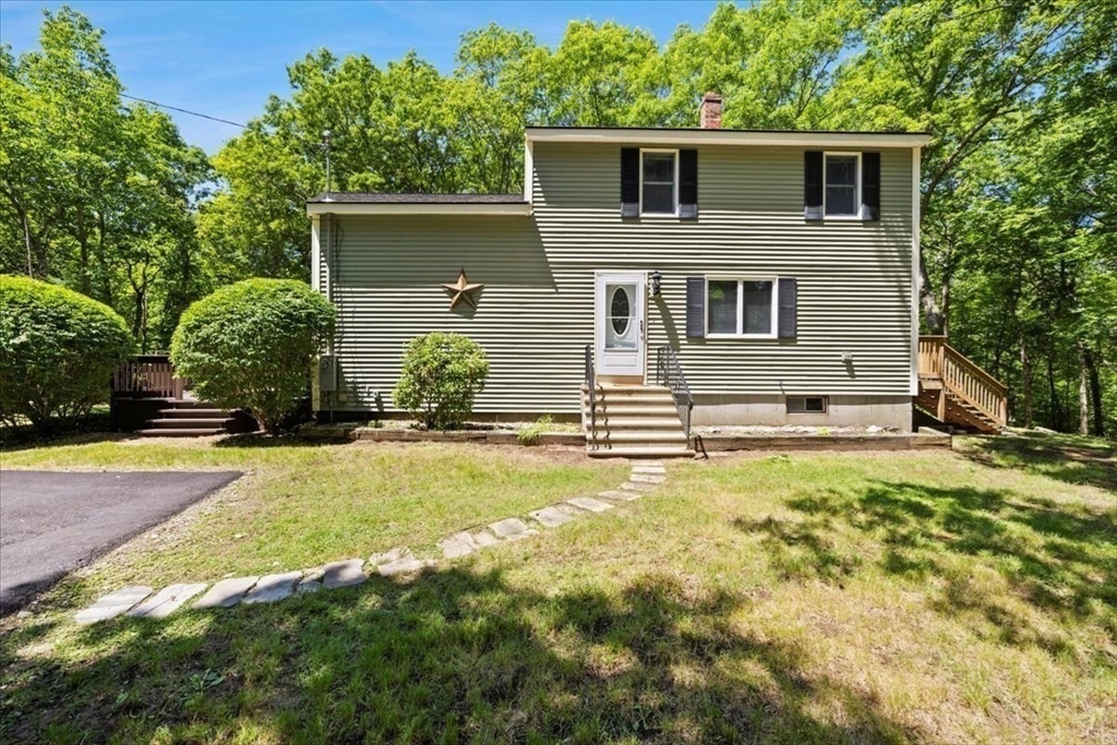 115 Douglas Road Webster, MA 01570 - Photo 2 of 42 a front view of a house with a yard