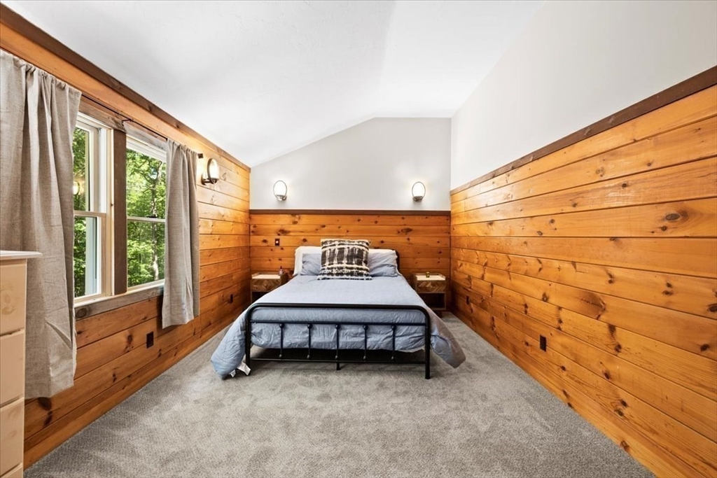 115 Douglas Road Webster, MA 01570 - Photo 30 of 42 a bed room with a bed and a window