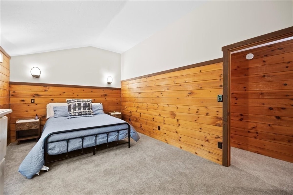 115 Douglas Road Webster, MA 01570 - Photo 31 of 42 a bedroom with a bed and a dresser