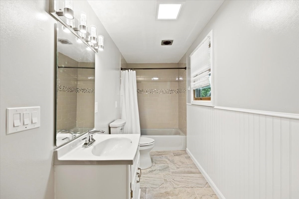 115 Douglas Road Webster, MA 01570 - Photo 35 of 42 a bathroom with a sink a toilet and shower