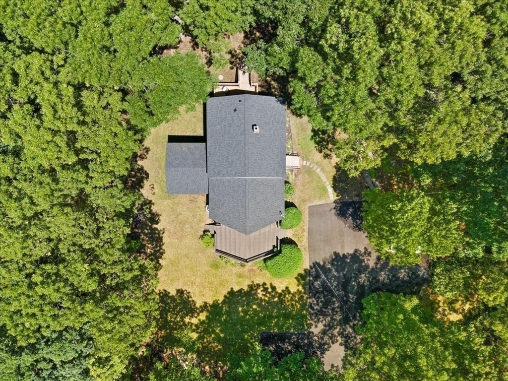 115 Douglas Road Webster, MA 01570 - Photo 40 of 42 an aerial view of a house with a yard and trees all around