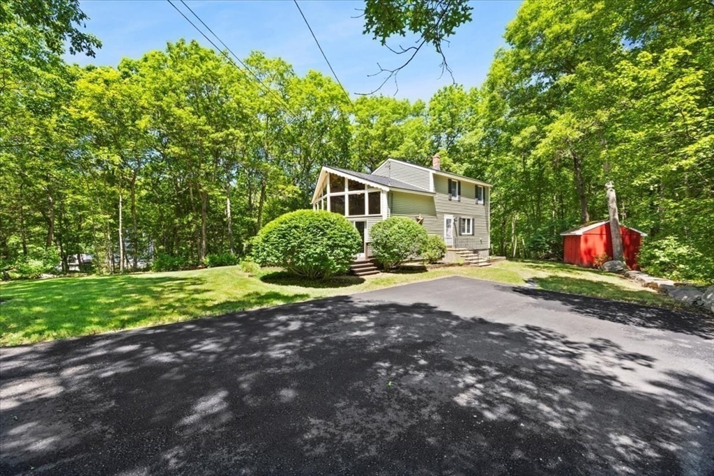115 Douglas Road Webster, MA 01570 - Photo 4 of 42 a view of backyard of house with green space