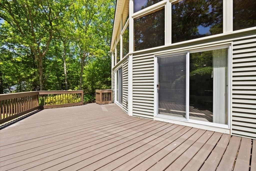 115 Douglas Road Webster, MA 01570 - Photo 7 of 42 a view of a balcony with wooden floor