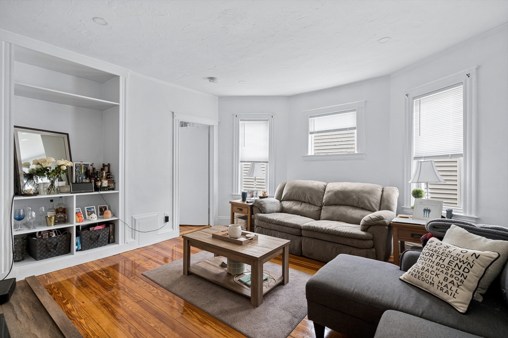 7 Hallam Street, Unit 3 Boston, MA 02125 - Photo 4 of 12 a living room with furniture and a couch