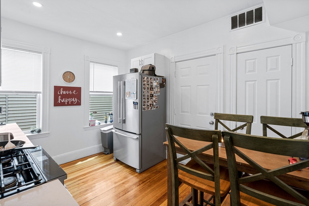 7 Hallam Street, Unit 3 Boston, MA 02125 - Photo 9 of 12 a view of a dining room with furniture and a window