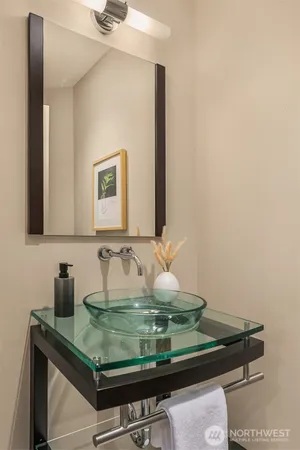 a bathroom with a mirror and a shower