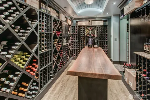 a bedroom with a bed and a mirror