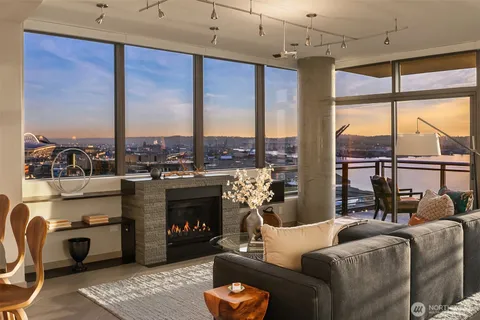 a living room with furniture a large window with outer view