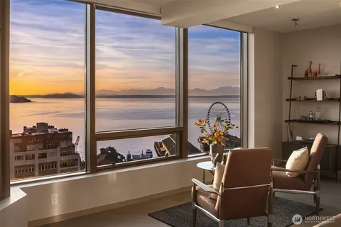 a view of a dining room with furniture window and outside view