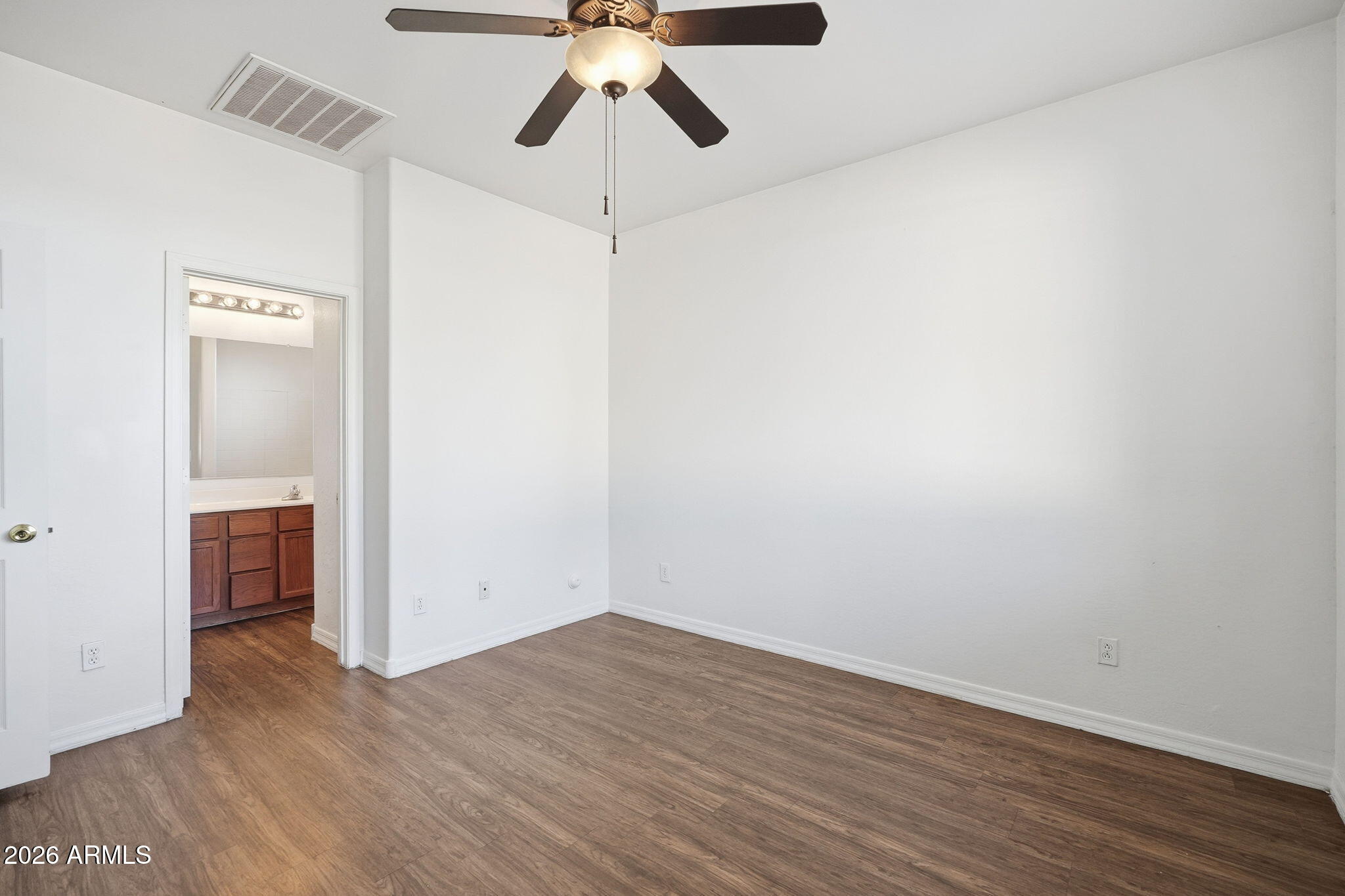 9360 West Payson Road Tolleson, AZ 85353 - Photo 20 of 33 wooden floor in an empty room