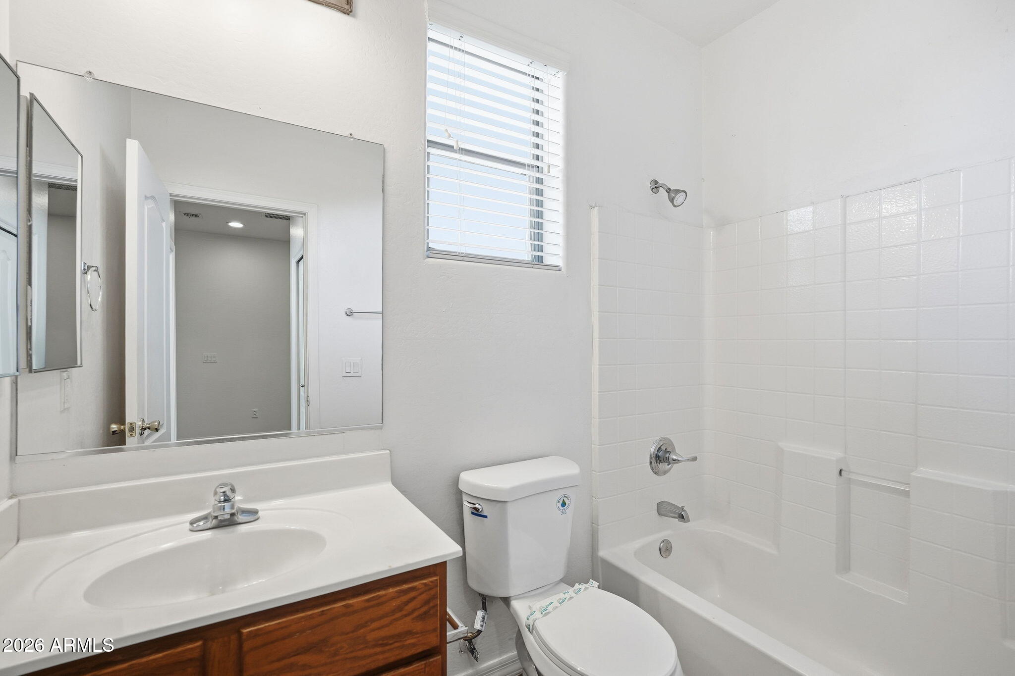 9360 West Payson Road Tolleson, AZ 85353 - Photo 25 of 33 a bathroom with a sink toilet and shower
