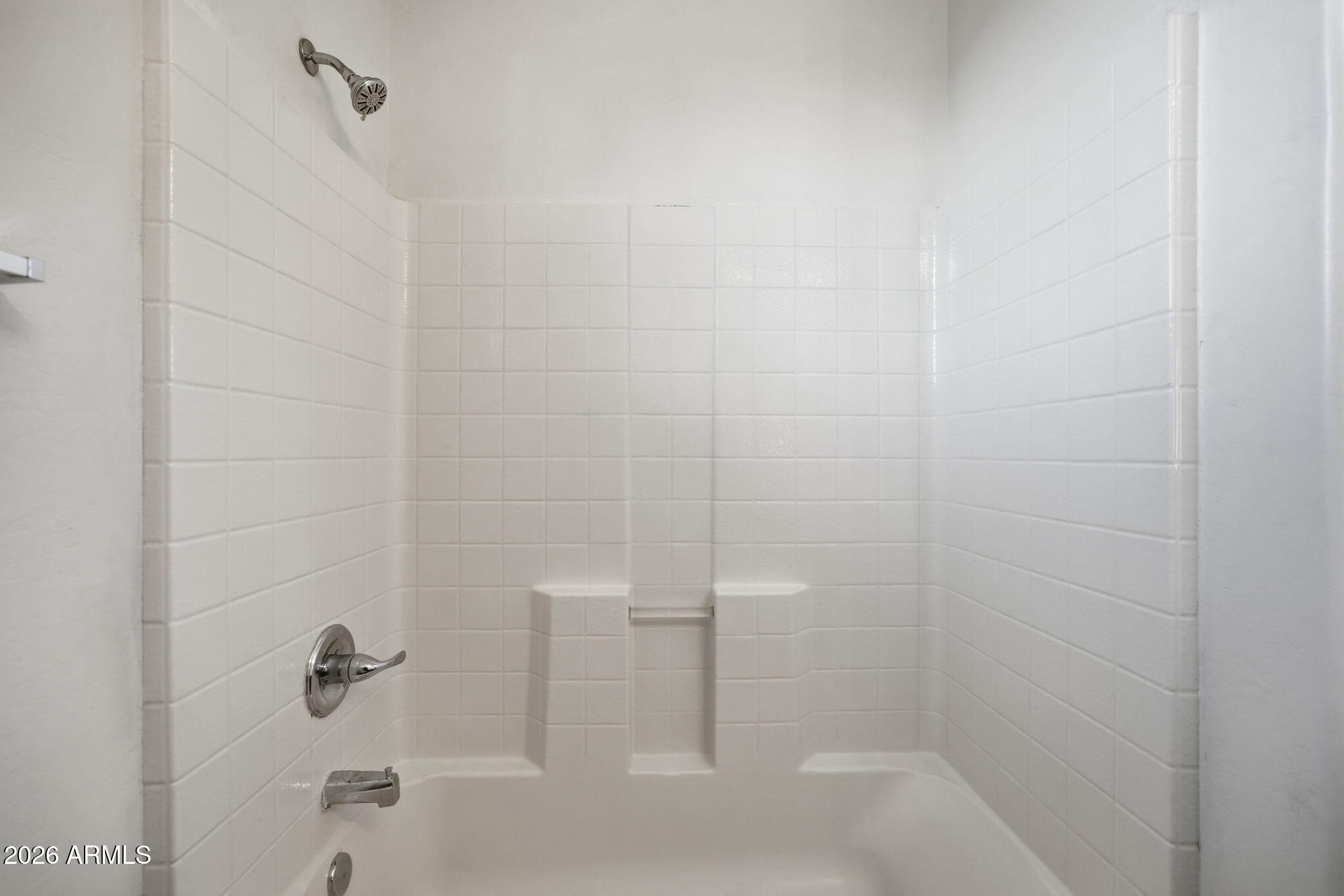 9360 West Payson Road Tolleson, AZ 85353 - Photo 28 of 33 a bathroom with a shower