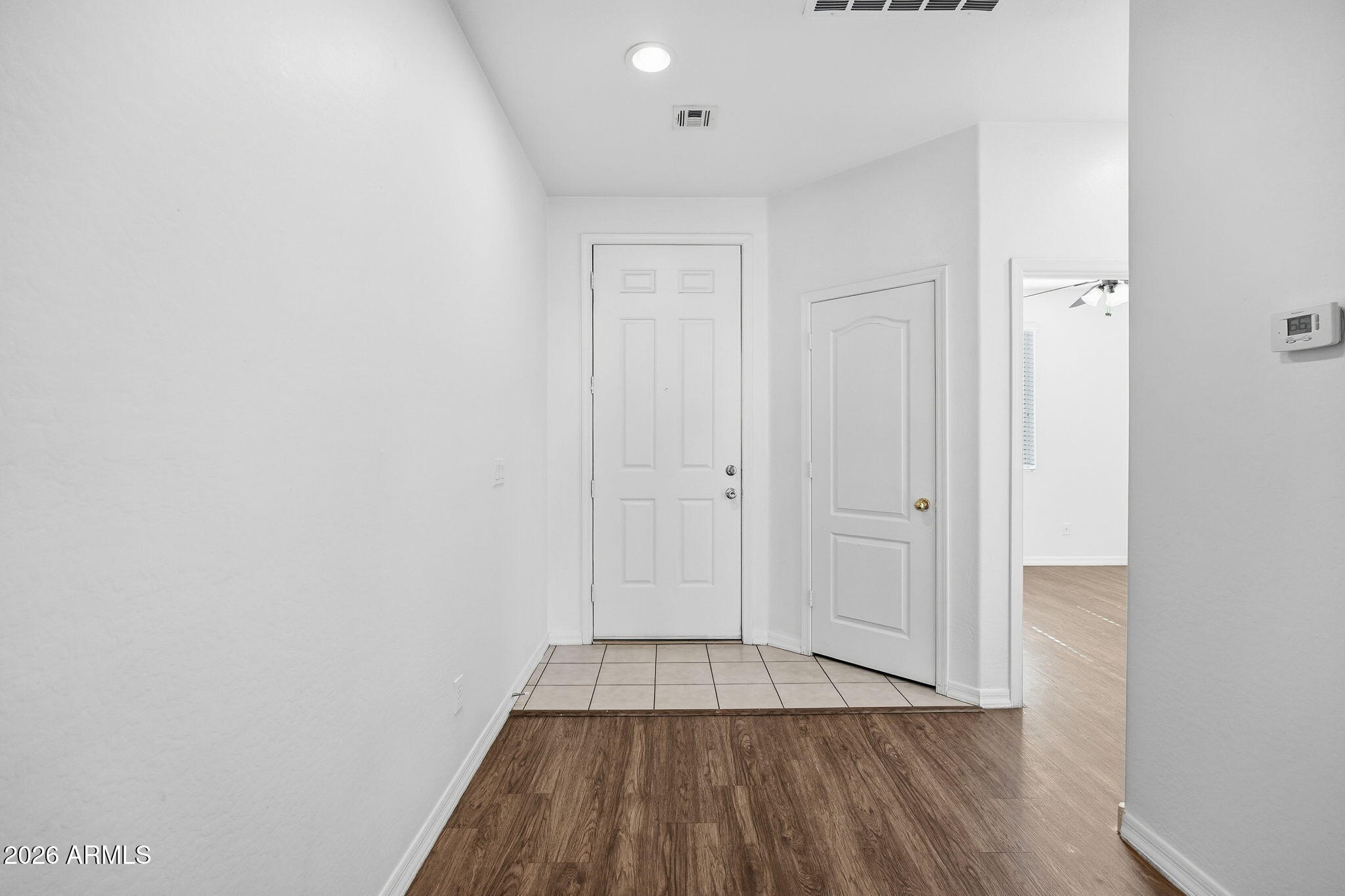 9360 West Payson Road Tolleson, AZ 85353 - Photo 5 of 33 a view of a room with wooden floor