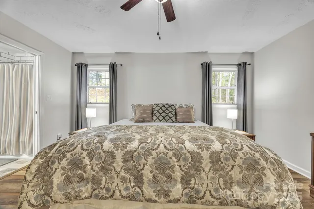 a bedroom with a bed and window