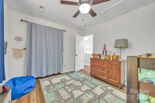 a bed room with a bed and a dresser