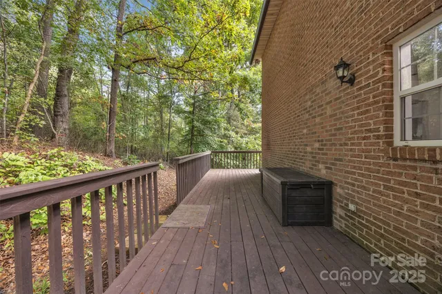 a view of balcony with wooden floor