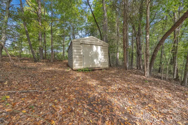 a view of a tiny house with a yard