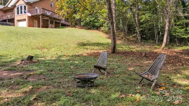 a view of a swimming pool with a yard