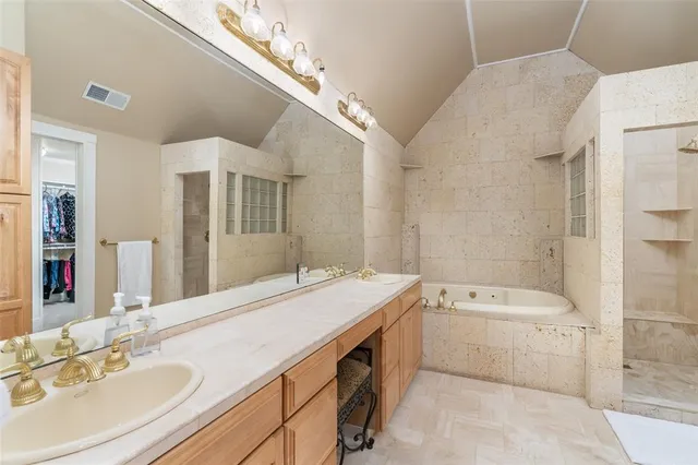 a bathroom with a sink double vanity and a mirror
