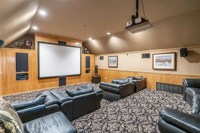 a living room with furniture a ceiling fan and a rug