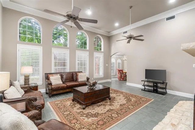 a living room with furniture rug and window