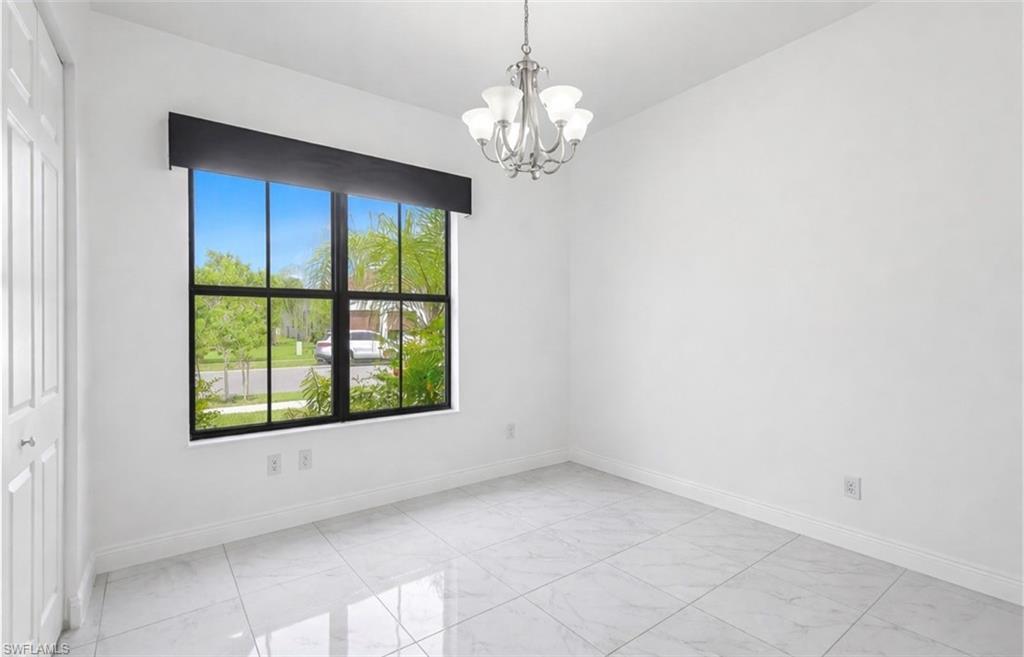 4761 Rosetta Terrace Ave Maria, FL 34142 - Photo 13 of 35 a view of an empty room with a window