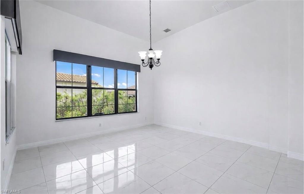 4761 Rosetta Terrace Ave Maria, FL 34142 - Photo 14 of 35 a view of a livingroom with a ceiling fan and window
