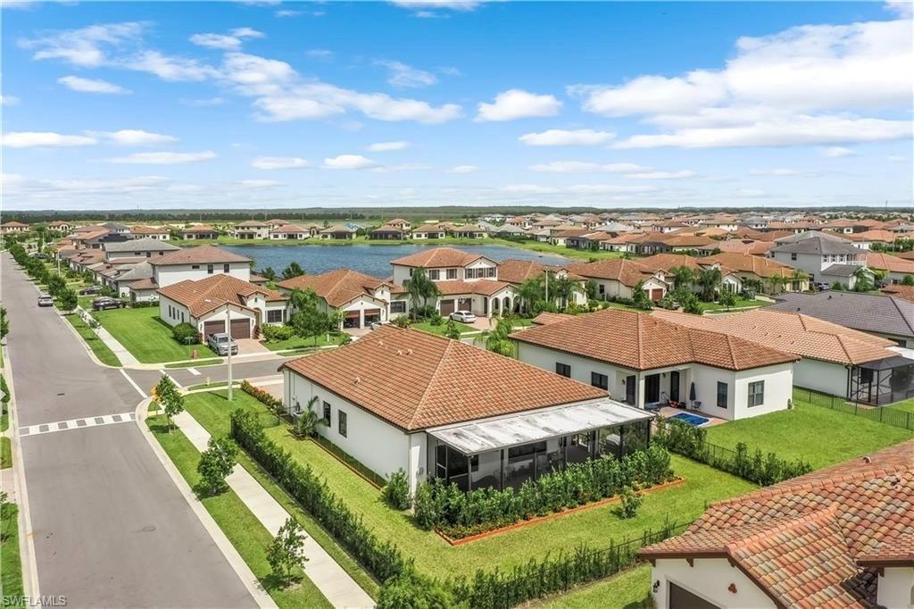 4761 Rosetta Terrace Ave Maria, FL 34142 - Photo 3 of 35 an aerial view of residential houses with outdoor space and ocean view
