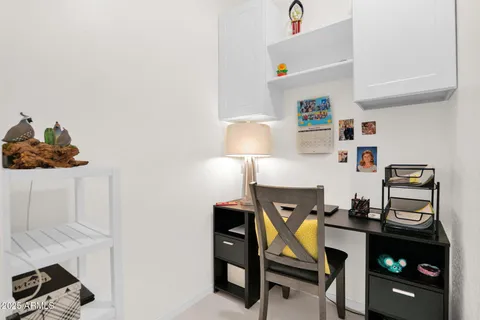 a living room with furniture and a lamp