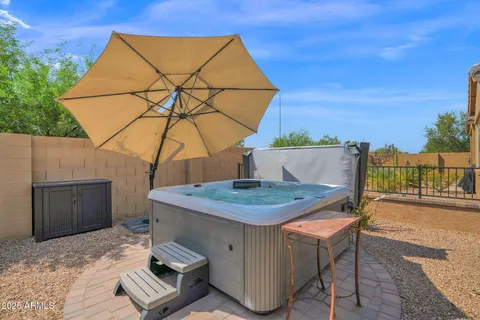 a view of a balcony with table and chairs