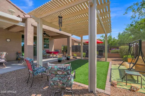 a view of an chairs and table in patio of a house