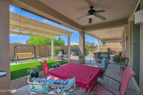 a patio with table and chairs