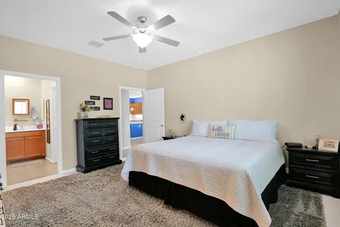 a bedroom with a bed and dresser