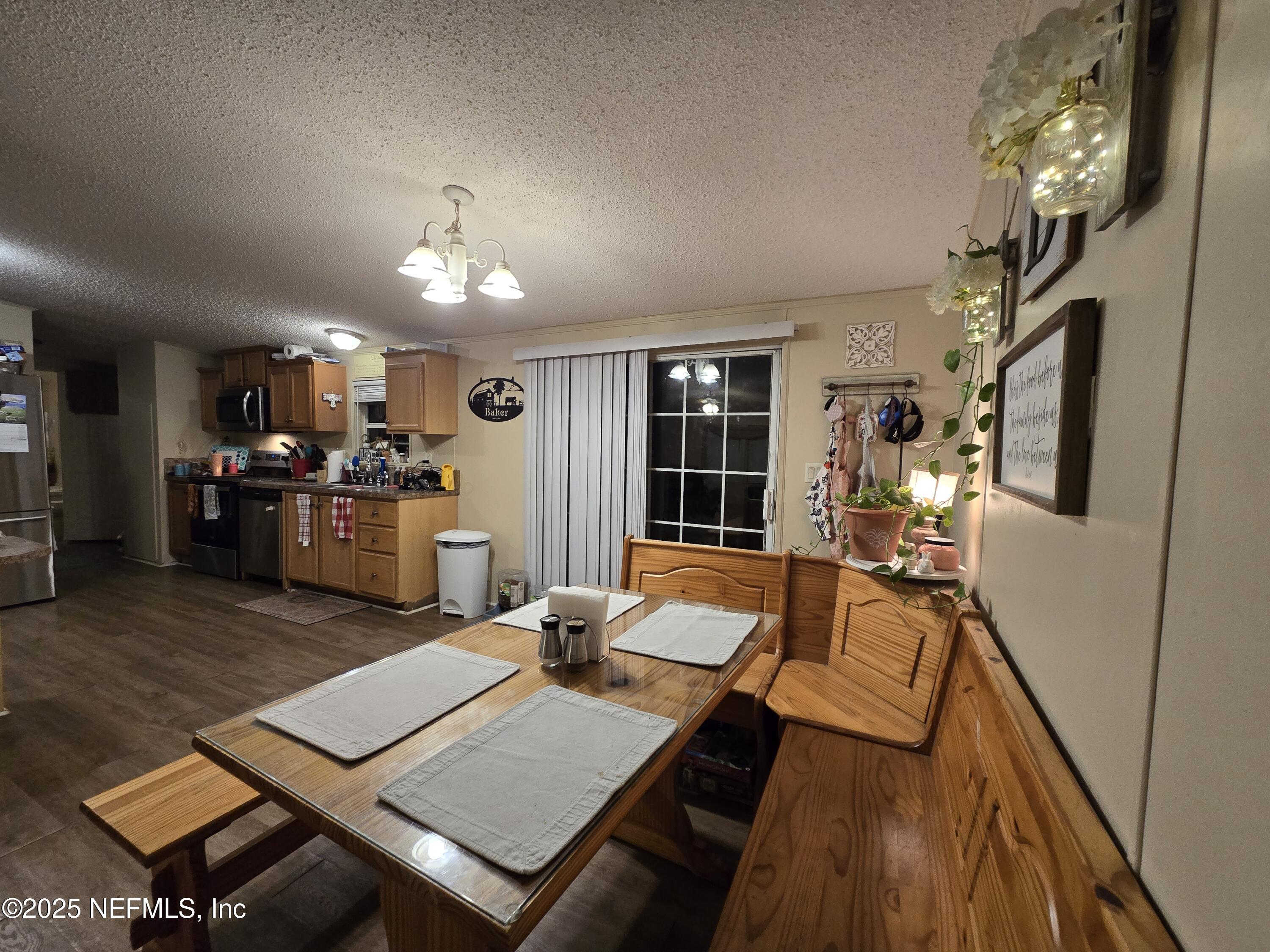 85050 Myrtice Road Yulee, FL 32097 - Photo 15 of 87 a living room with furniture and a wooden floor