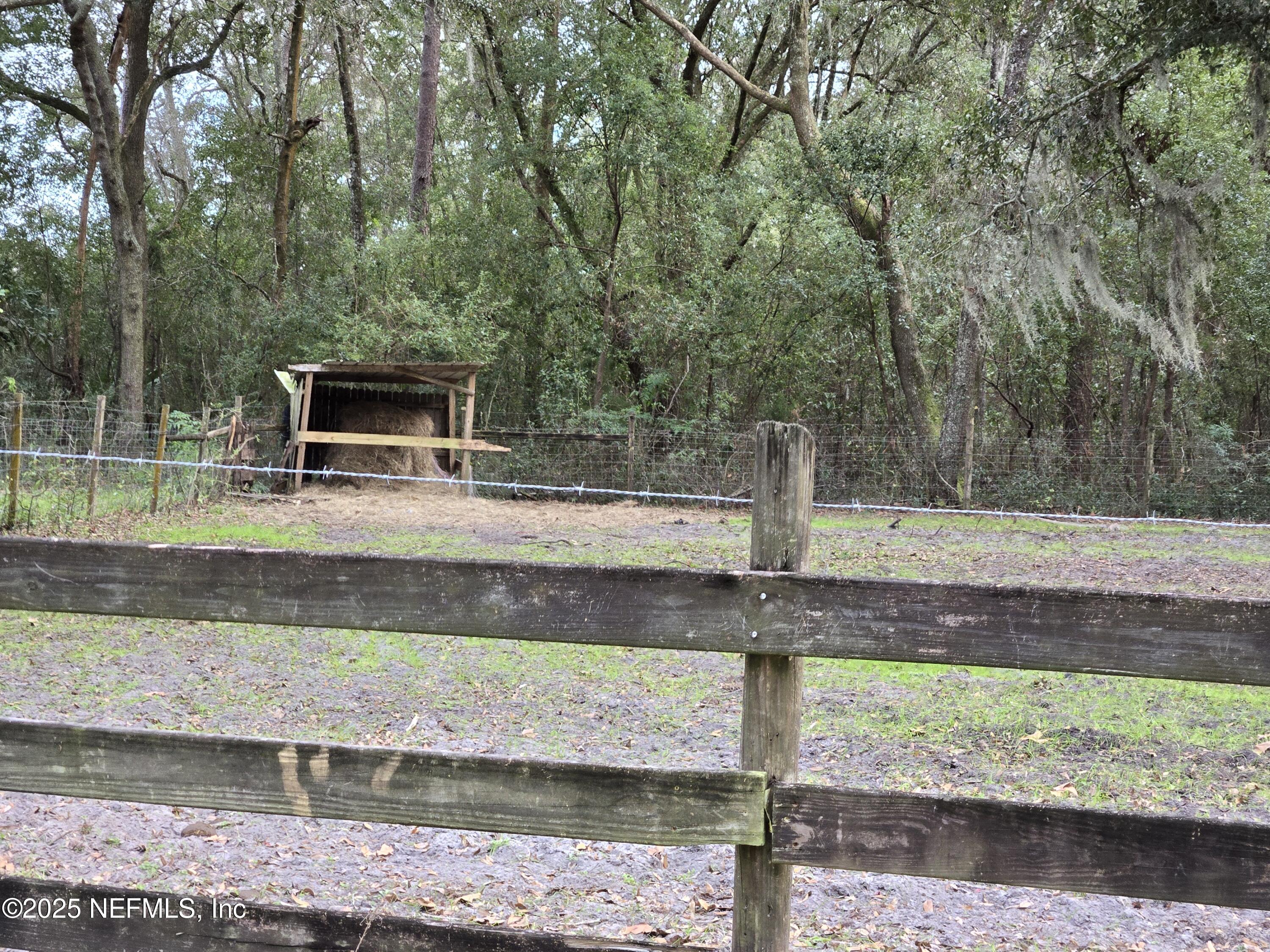 85050 Myrtice Road Yulee, FL 32097 - Photo 57 of 87 a view of a yard with wooden fence