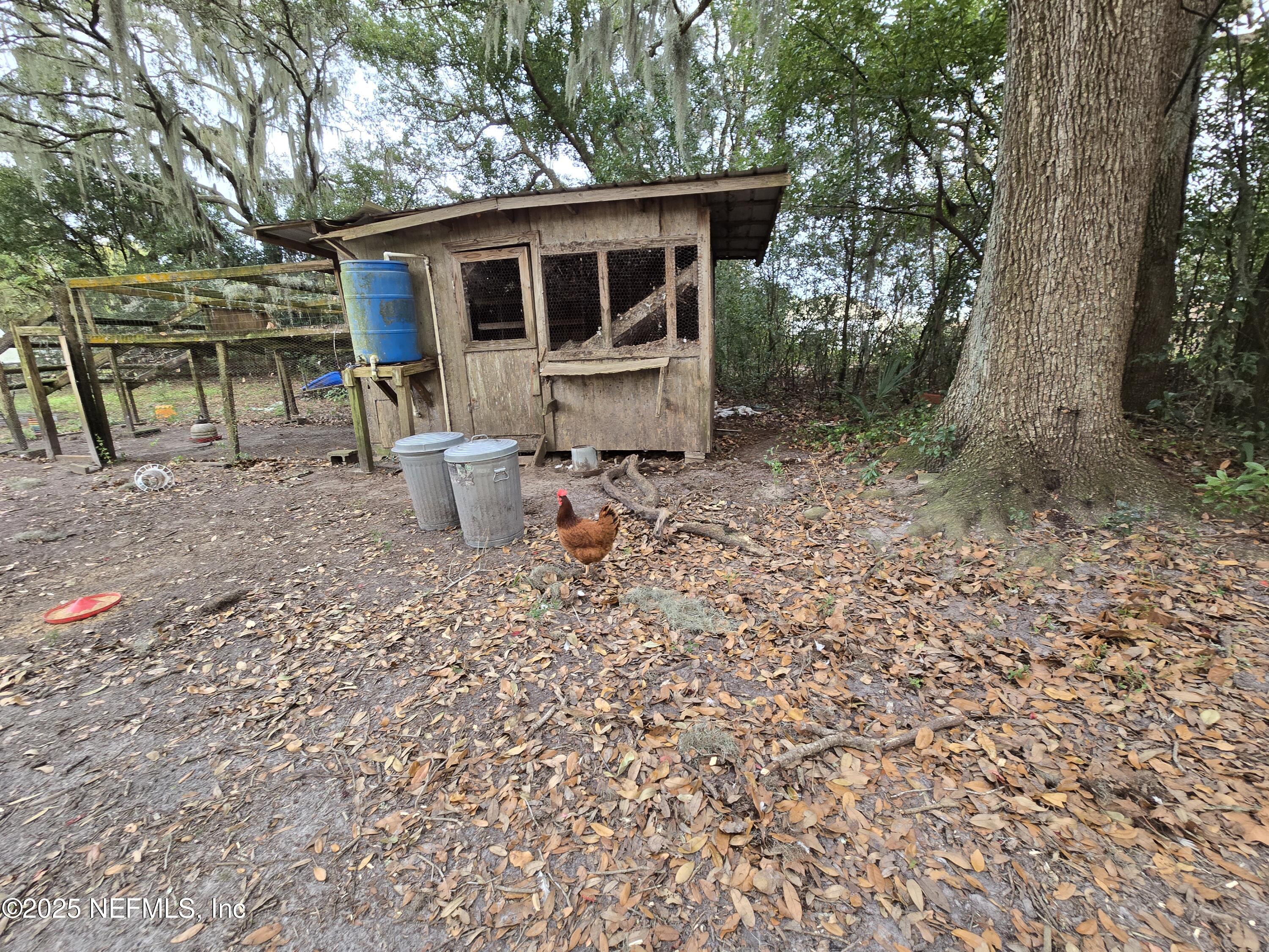 85050 Myrtice Road Yulee, FL 32097 - Photo 80 of 87 a backyard of a house with seating space
