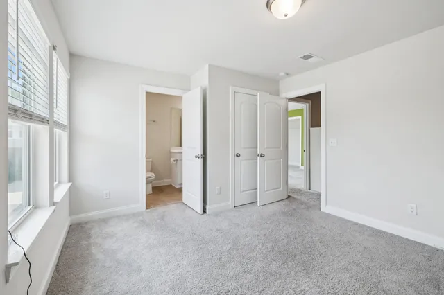 a view of empty room with windows