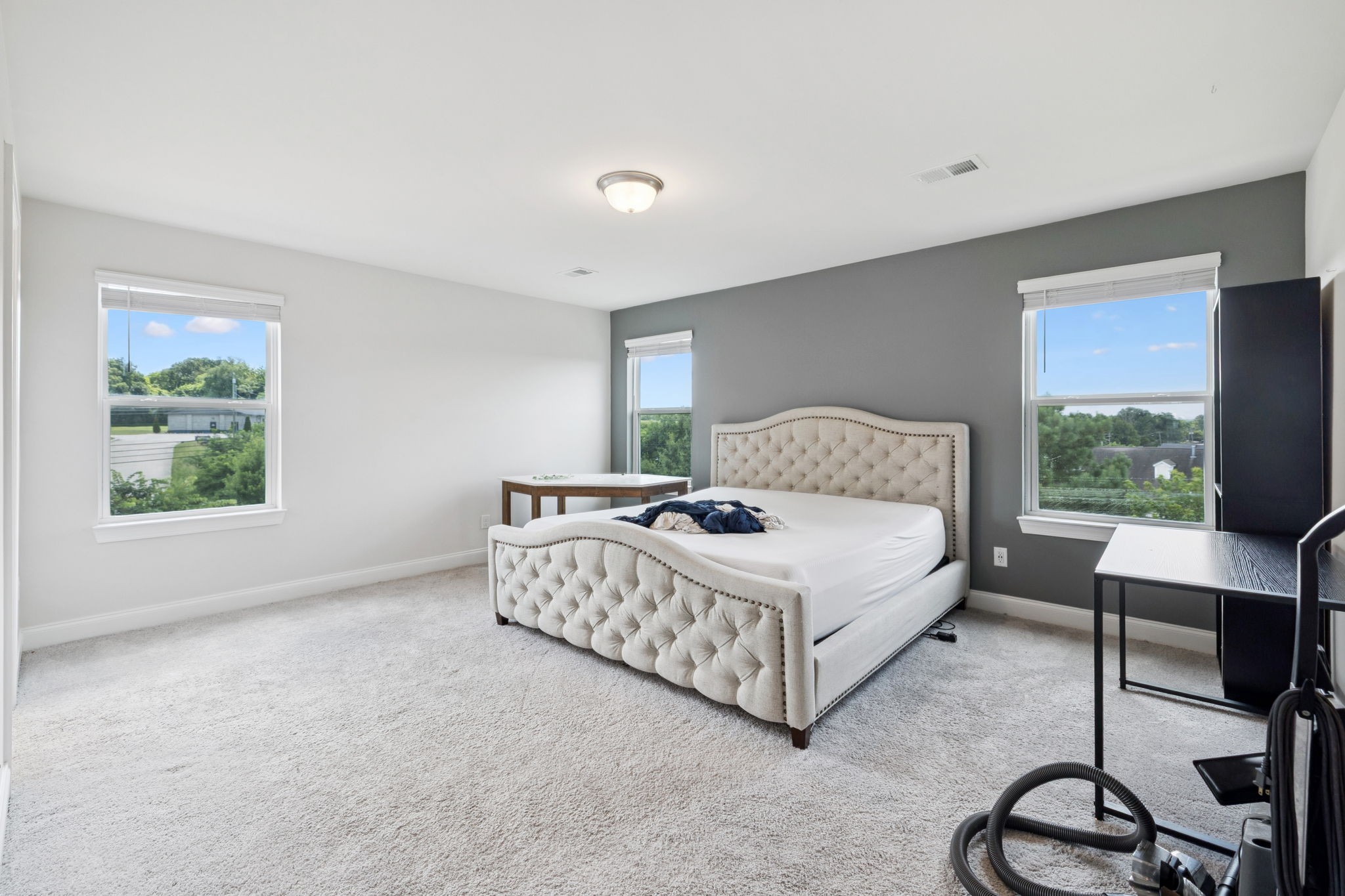 862 Longleaf Lane Columbia, TN 38401 - Photo 21 of 35 a bedroom with a bed a table and windows