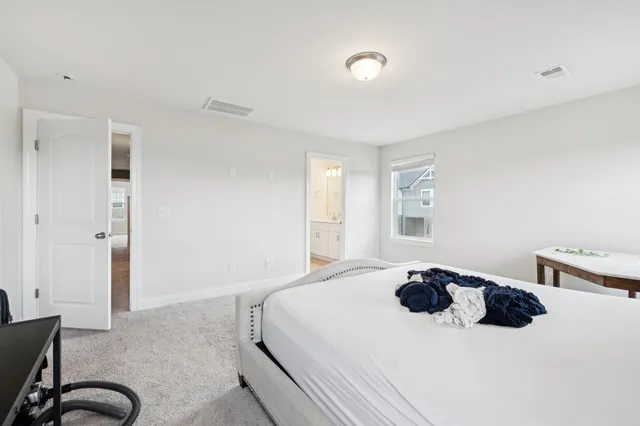 a bedroom with a bed and a cabinets