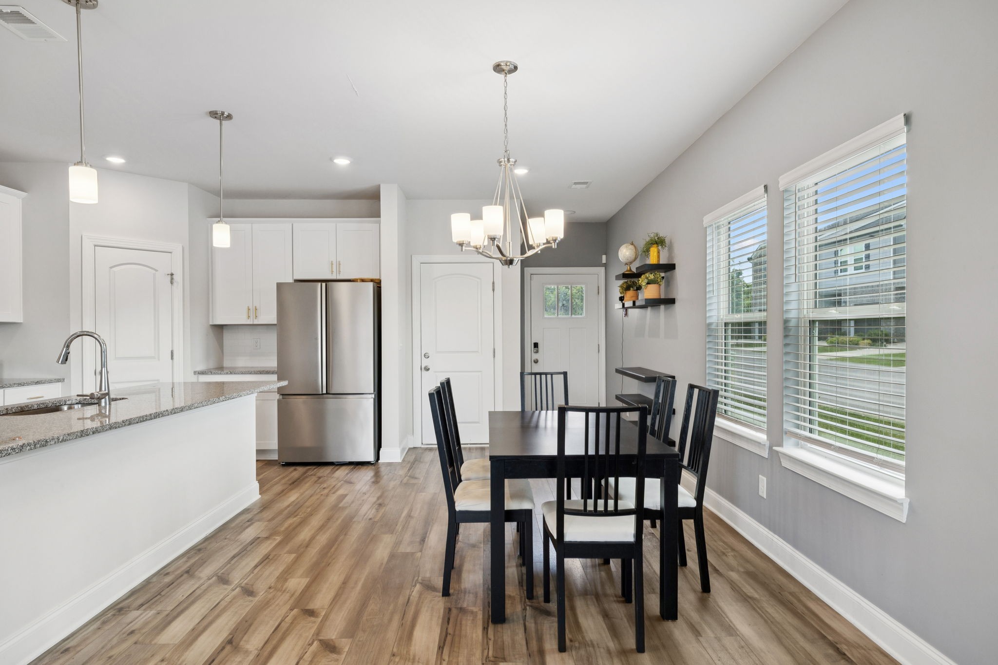 862 Longleaf Lane Columbia, TN 38401 - Photo 35 of 35 a view of a dining room with furniture a chandelier and wooden floor