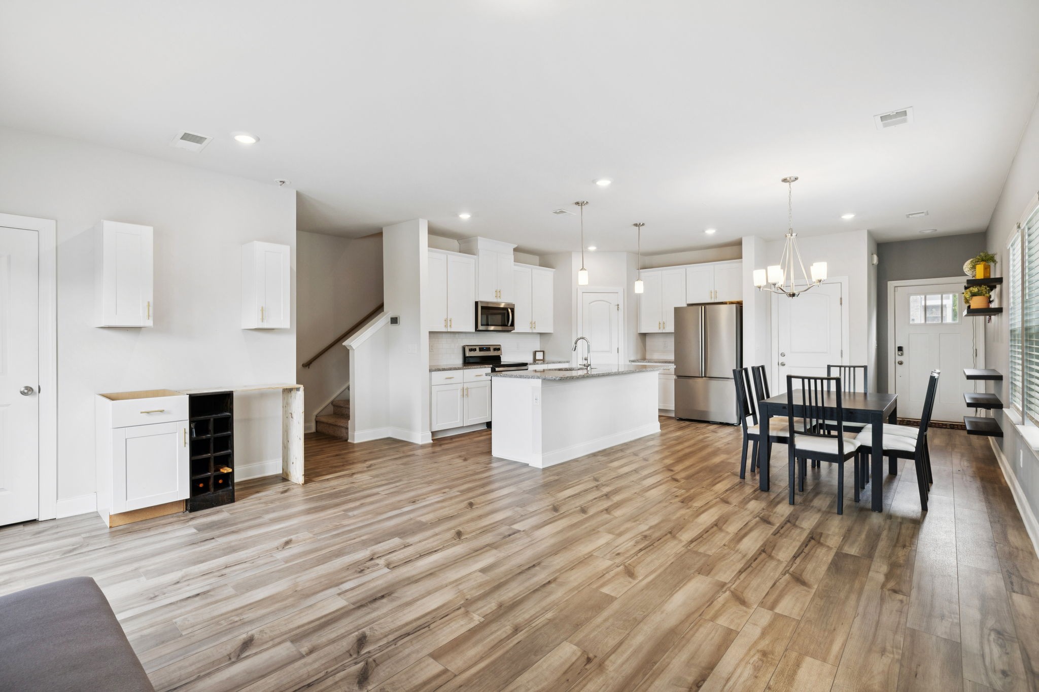 862 Longleaf Lane Columbia, TN 38401 - Photo 8 of 35 an open kitchen with kitchen island and stainless steel appliances