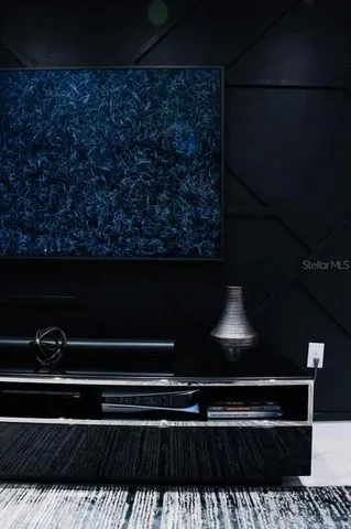 a kitchen with stainless steel appliances a sink a stove a refrigerator and cabinets