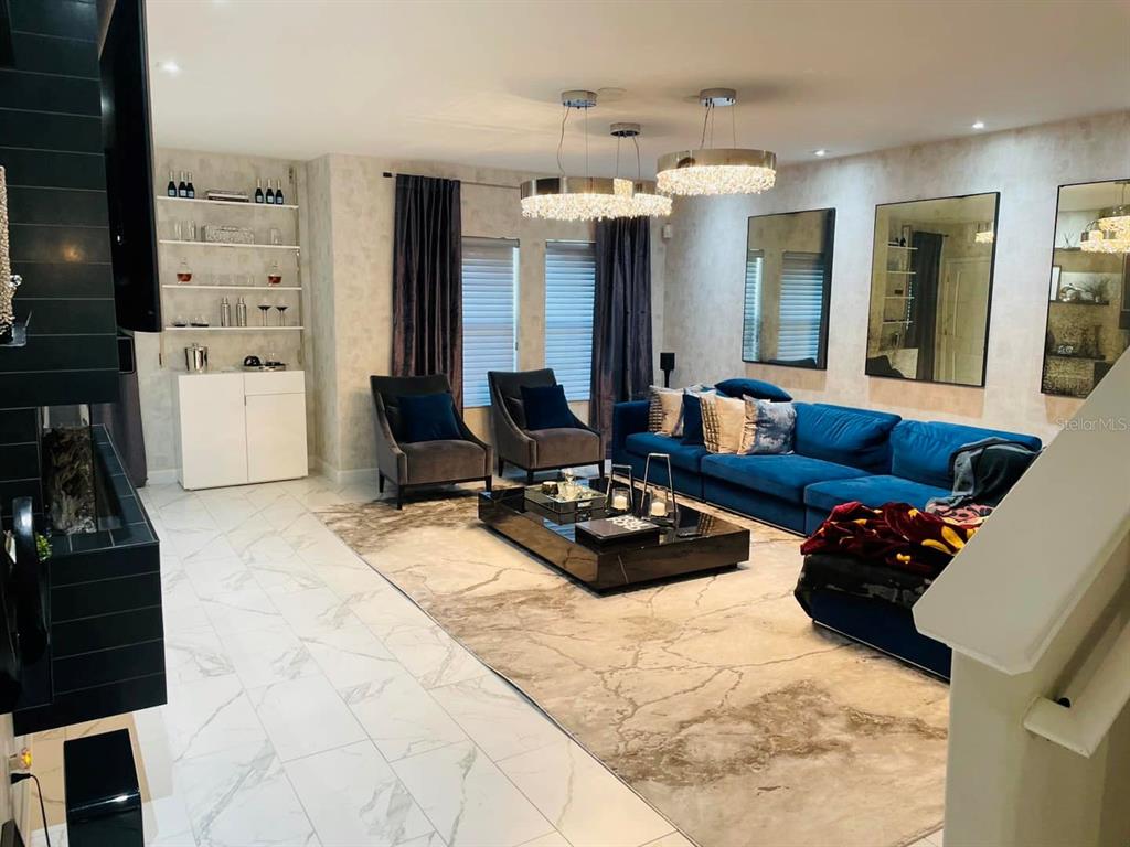 711 North Rome Avenue Tampa, FL 33606 - Photo 13 of 17 a living room with furniture and wooden floor