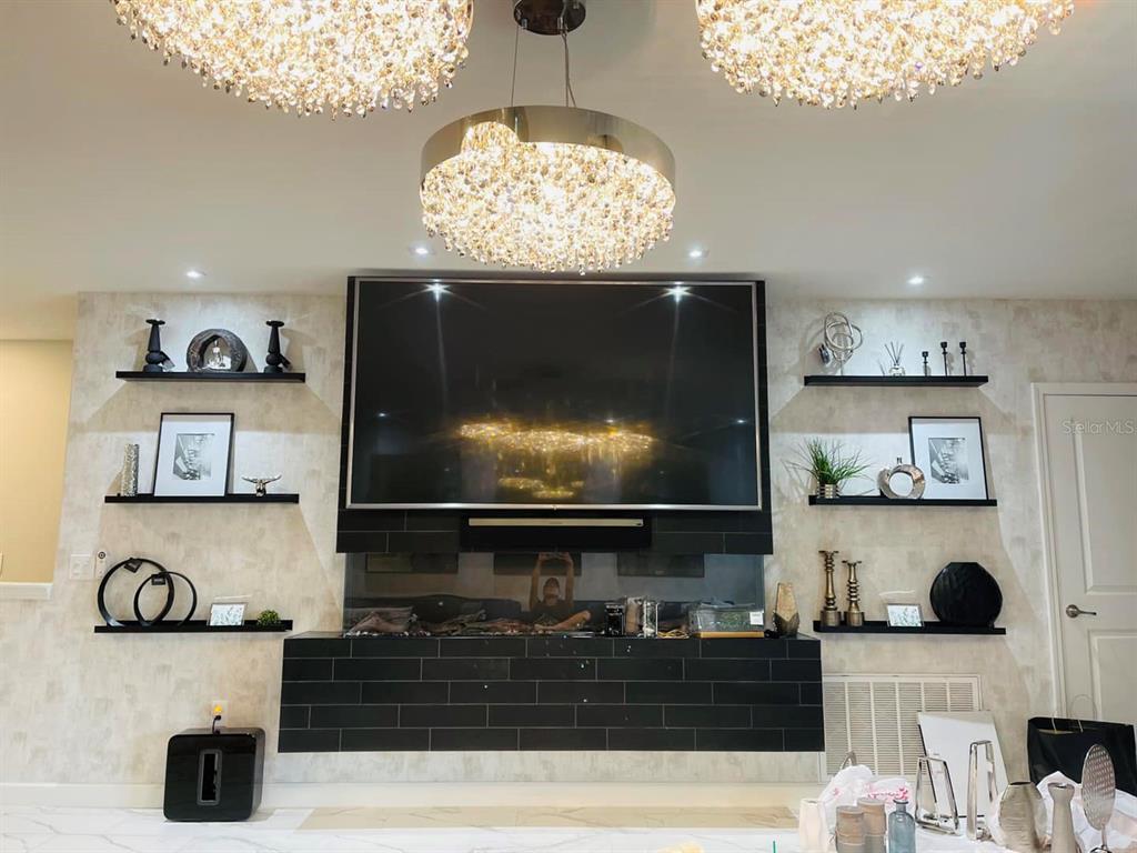 711 North Rome Avenue Tampa, FL 33606 - Photo 5 of 17 a living room with furniture and a flat screen tv