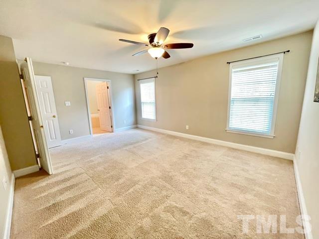 11239 11239th Raleigh, NC 27617 - Photo 13 of 26 a view of an empty room with a window
