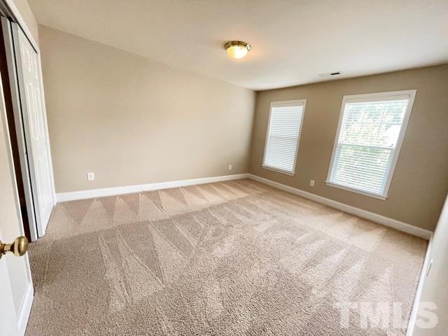 11239 11239th Raleigh, NC 27617 - Photo 18 of 26 an empty room with windows