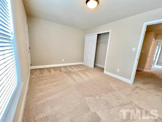 11239 11239th Raleigh, NC 27617 - Photo 19 of 26 an empty room with windows