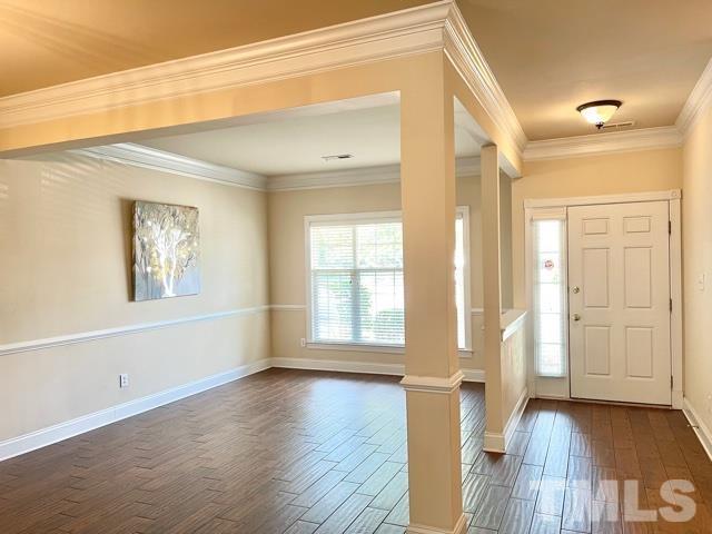 11239 11239th Raleigh, NC 27617 - Photo 3 of 26 a view of an empty room with wooden floor and a window
